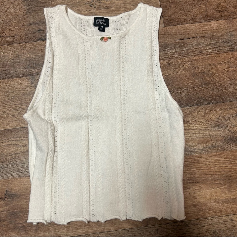 beverly and beck white soft tank top with lettuce detail and pink flower on coll